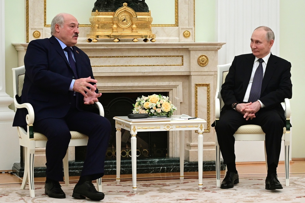 Belarusian President Alexander Lukashenko, left, gestures while speaking to Russian President Vladimir Putin during their talks at the Kremlin in Moscow, Russia, Wednesday, April 5, 2023.