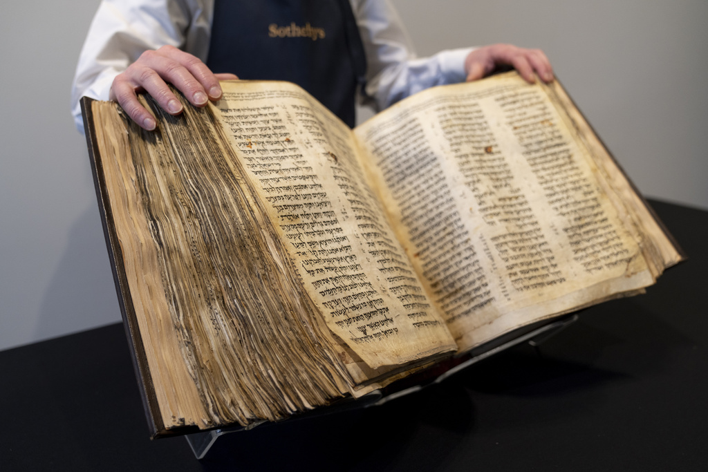 FILE - Sotheby's unveils the Codex Sassoon for auction, Wednesday, Feb. 15, 2023, in the Manhattan borough of New York. The 1,100-year-old Hebrew Bible that is one of the oldest surviving biblical manuscripts sold for $38.1 million, which includes the auction house's fee, Wednesday, May 17, 2023, in New York.