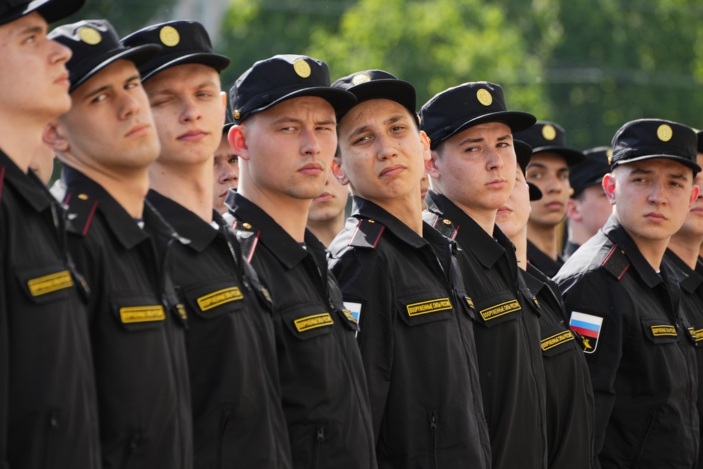 Russian conscripts stand in line during a send-off event before they head to assigned military units for mandatory one-year military service in St. Petersburg, Russia, Tuesday, May 23, 2023. Russian President Vladimir Putin has signed a decree to enroll 147,000 conscripts aged 18-27 into the army during spring draft. Those drafted will do one year of mandatory military service. (