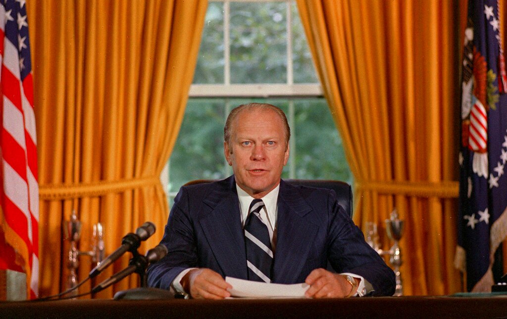 President Gerald Ford reads a proclamation in the White House on Sept. 8, 1974 granting former president Richard Nixon "a full, free and absolute pardon" for all "offenses against the United States" during the period of his presidency.
