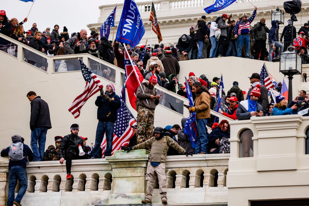 WASHINGTON, DC - JANUARY 06: Pro-Trump supporters storm the U.S. Capitol following a rally with President Donald Trump on January 6, 2021 in Washington, DC. Trump supporters gathered in the nation's capital today to protest the ratification of President-elect Joe Biden's Electoral College victory over President Trump in the 2020 election. (Photo by