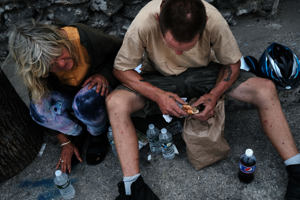 PHILADELPHIA, PENNSYLVANIA - JULY 19: Rich and Peg prepare to shoot-up a mix of heroin and fentanyl on a street in Kensington on July 19, 2021 in Philadelphia, Pennsylvania. According to data from the US Centers for Disease Control and Prevention's National Center for Health Statistics, over 93,000 people died from a drug overdose last year in America. These numbers and the continued rise in opioid use made 2020 the deadliest year on record for drug overdoses. Officials have said that the increase is being driven by the lethal prevalence of fentanyl and stressed Americans due to the Covid pandemic. Kensington, a neighborhood in Philadelphia, has become one of the largest open-air heroin markets in the United States.