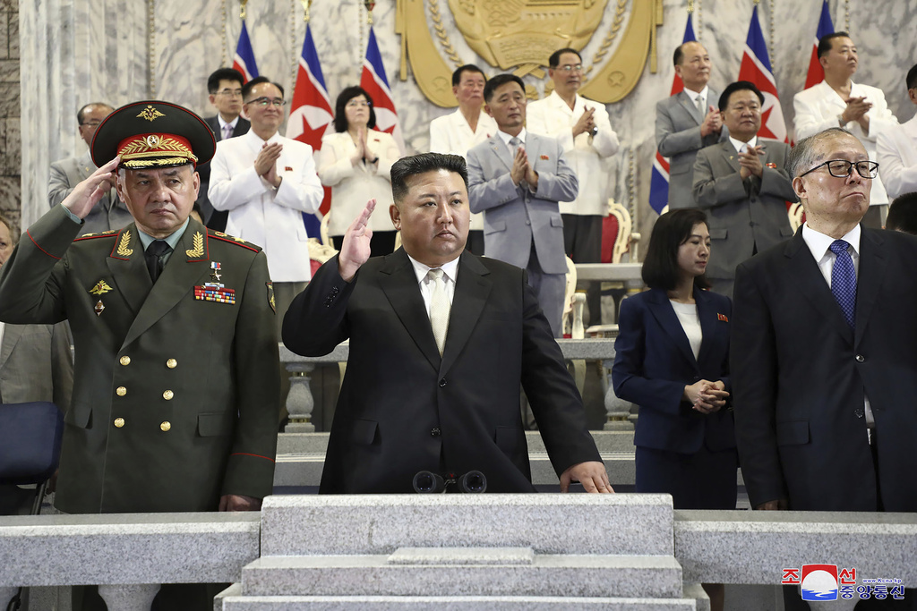 In this photo provided by the North Korean government, North Korean leader Kim Jong Un, center, Russian Defense Minister Sergei Shoigu, left, and China's Vice Chairman of the standing committee of the country’s National People’s Congress Li Hongzhong, right, attend a military parade to mark the 70th anniversary of the armistice that halted fighting in the 1950-53 Korean War, on Kim Il Sung Square in Pyongyang, North Korea Thursday, July 27, 2023. Independent journalists were not given access to cover the event depicted in this image distributed by the North Korean government. The content of this image is as provided and cannot be independently verified. Korean language watermark on image as provided by source reads: "KCNA" which is the abbreviation for Korean Central News Agency.