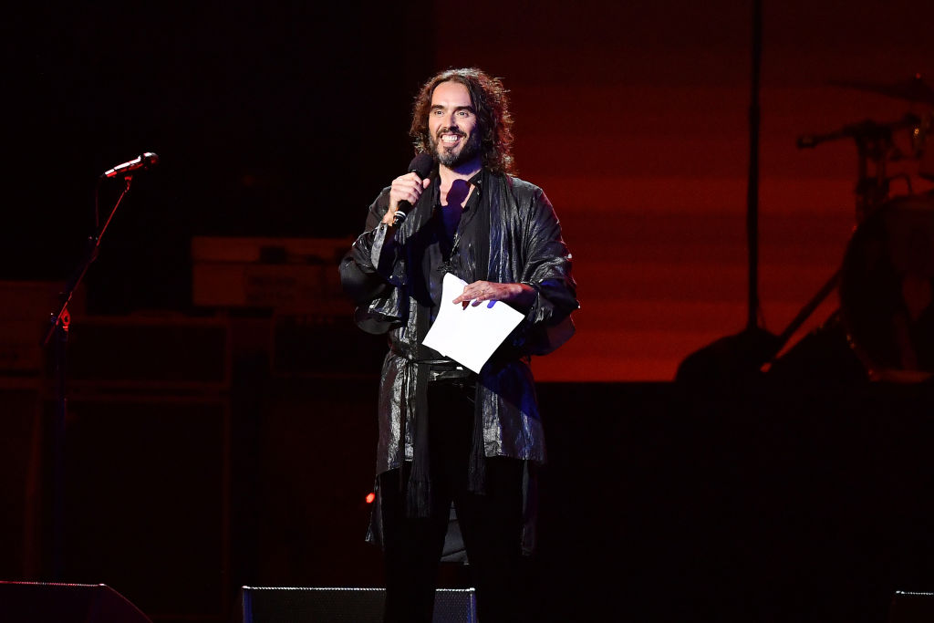 LOS ANGELES, CALIFORNIA - JANUARY 24: Host Russell Brand speaks onstage during MusiCares Person of the Year honoring Aerosmith at West Hall at Los Angeles Convention Center on January 24, 2020 in Los Angeles, California. (Photo by