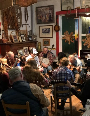 Bluegrass musicians play inside Phipps Country Store.