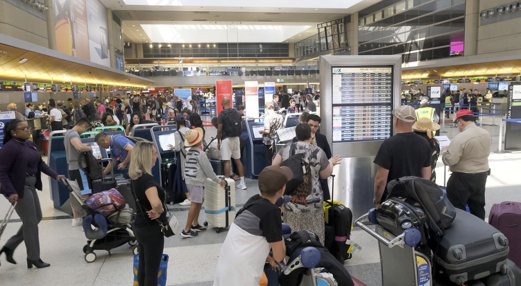 Travelers at the Tom Brady International Terminal at Los Angeles, California, on August 30, 2023.