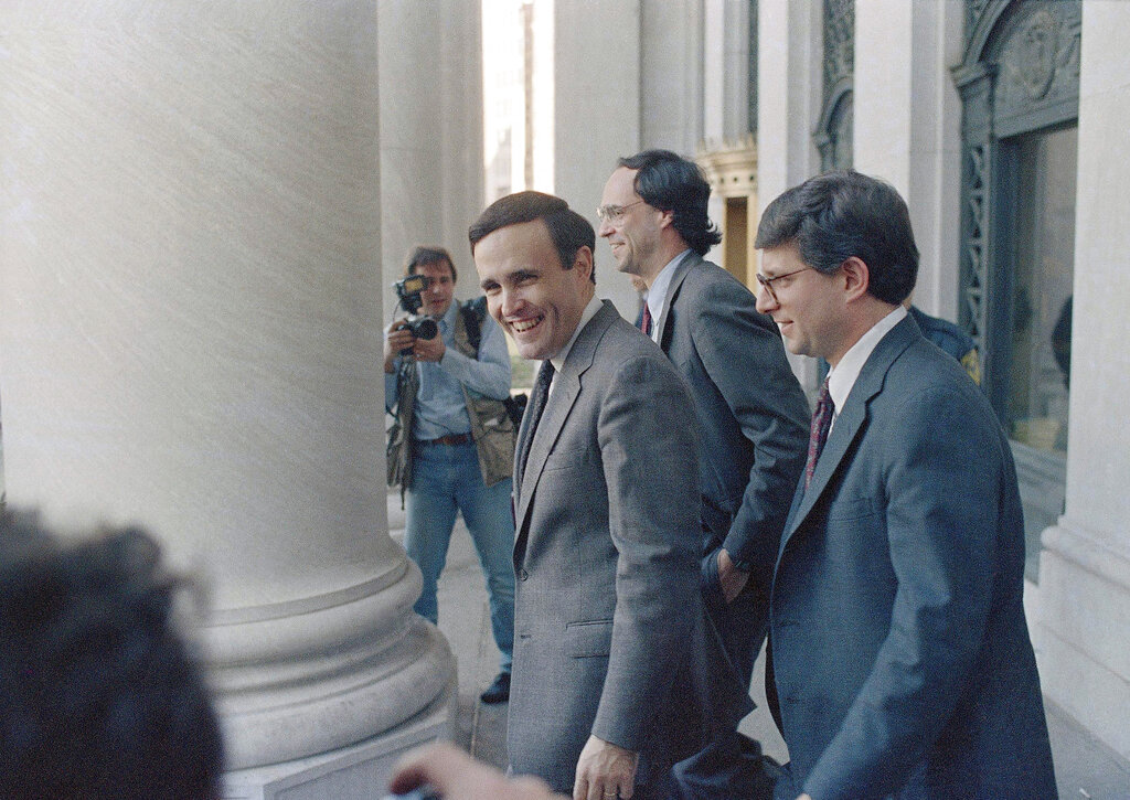 U.S. Attorney Rudolph Giuliani, right, with Ronald Goldstock, left, director of the State Organized Crime Task Force, and trial lawyer Barry Slotnick before speaking at the New York Post Forum on Organized Crime in New York, March 13, 1986. Giuliani said there is a "natural connection" between organized crime and corrupt politicians but refused to say if there was such a link in the Parking Violations Bureau scandal.