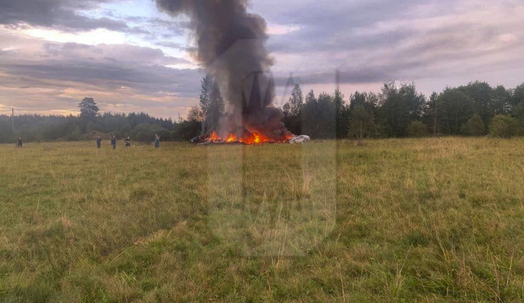 This watermarked image released by Ostorozhno Novosti on August 23, 2023, shows the crash site of a private jet near the village of Kuzhenkino, Tver Region.