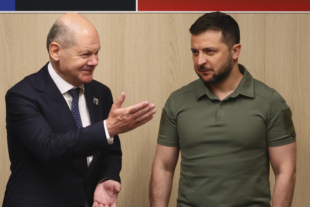 Ukraine's President Volodymyr Zelenskyy, right, meets with Germany's Chancellor Olaf Scholz during a NATO summit in Vilnius, Lithuania, Wednesday, July 12, 2023.