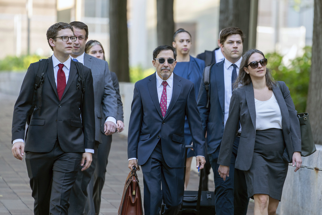 Department of Justice lawyers, including Kenneth Dintzer, center, and Megan Bellshaw, right, at Washington, D.C., on September 12, 2023.