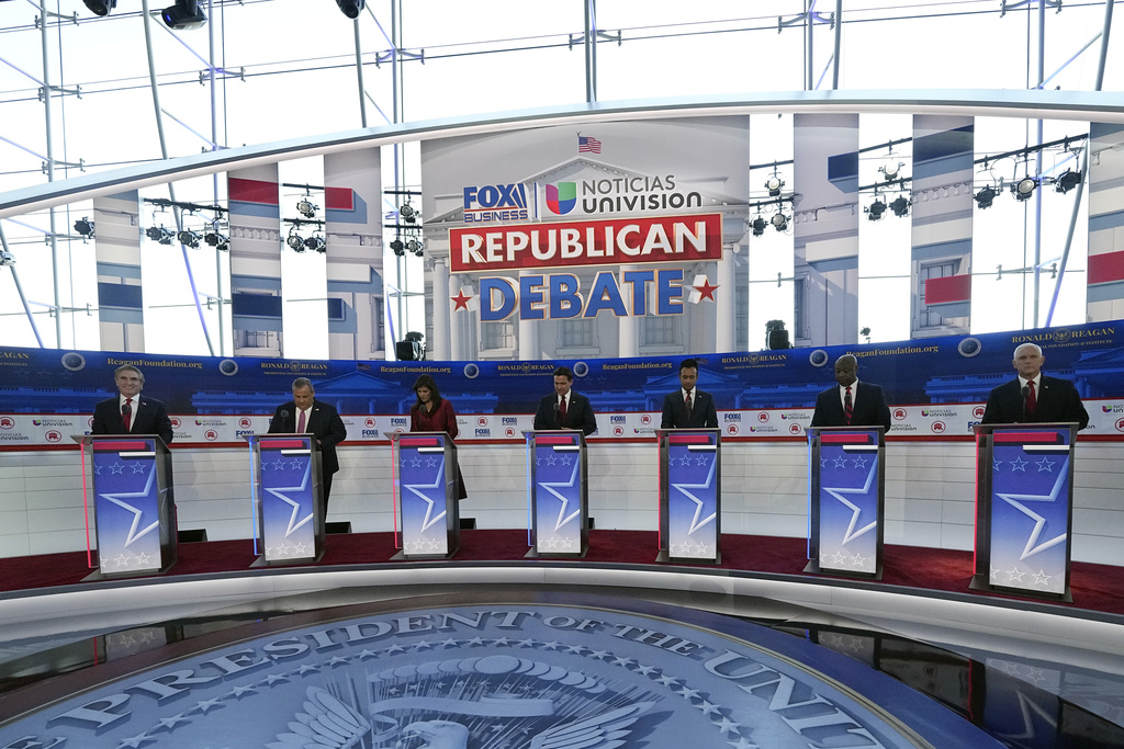 Republican presidential candidates, from left, North Dakota Gov. Doug Burgum, former New Jersey Gov. Chris Christie, former U.N. Ambassador Nikki Haley, Florida Gov. Ron DeSantis, entrepreneur Vivek Ramaswamy, Sen. Tim Scott, R-S.C., and former Vice President Mike Pence, stand at their podiums during a Republican presidential primary debate hosted by FOX Business Network and Univision, Wednesday, Sept. 27, 2023, at the Ronald Reagan Presidential Library in Simi Valley, Calif. (
