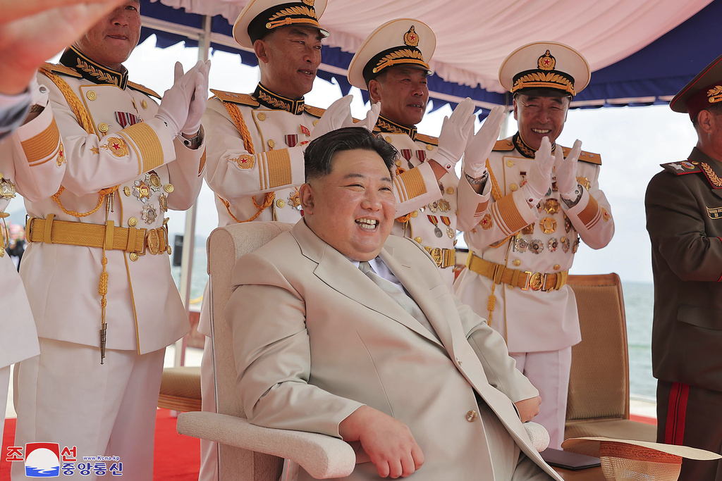 In this photo provided by the North Korean government, North Korea leader Kim Jong Un, bottom, attends a launching ceremony of what is says a new nuclear attack submarine "Hero Kim Kun Ok" at an unspecified place in North Korea Wednesday, Sept. 6, 2023. Independent journalists were not given access to cover the event depicted in this image distributed by the North Korean government. The content of this image is as provided and cannot be independently verified. Korean language watermark on image as provided by source reads: "KCNA" which is the abbreviation for Korean Central News Agency. (