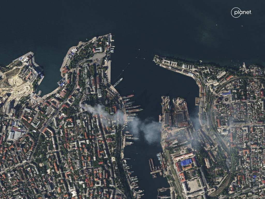In this satellite photo provided by Planet Labs, smoke billows from a headquarters building for the Russian Black Sea fleet in Sevastopol, Crimea on Friday, Sept. 22, 2023, after it was struck in a missile attack launched by the Ukrainian military.