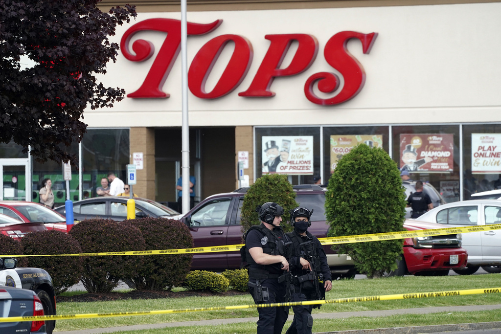 Police secure the area around a supermarket where several people were killed at Buffalo, New York, May 14, 2022.