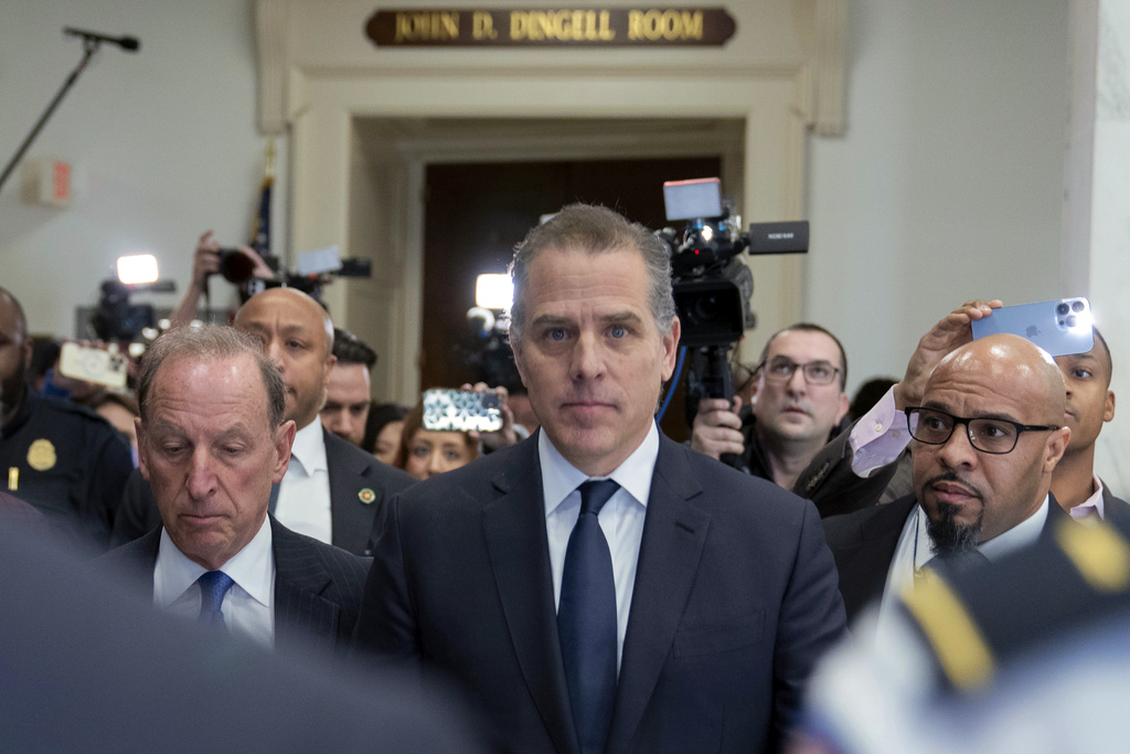 Hunter Biden, President Biden's son, accompanied by his attorney, Abbe Lowell, leaves a House Oversight Committee hearing on Capitol Hill.