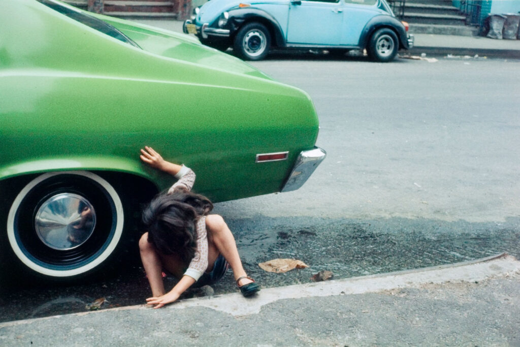 Helen Leavitt's 'Girl Playing Under Green Car, New York City.'