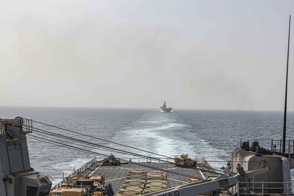 In this image provided by the U.S. Navy, the amphibious dock landing ship USS Carter Hall and amphibious assault ship USS Bataan transit the Bab al-Mandeb strait on Aug. 9, 2023. The top commander of U.S. naval forces in the Middle East says Yemen’s Houthi rebels are showing no signs of ending their “reckless” attacks on commercial ships in the Red Sea. But Vice Adm. Brad Cooper said in an Associated Press interview on Saturday that more nations are joining the international maritime mission to protect vessels in the vital waterway and trade traffic is beginning to pick up. (Mass Communications Spc. 2nd Class Moises Sandoval
