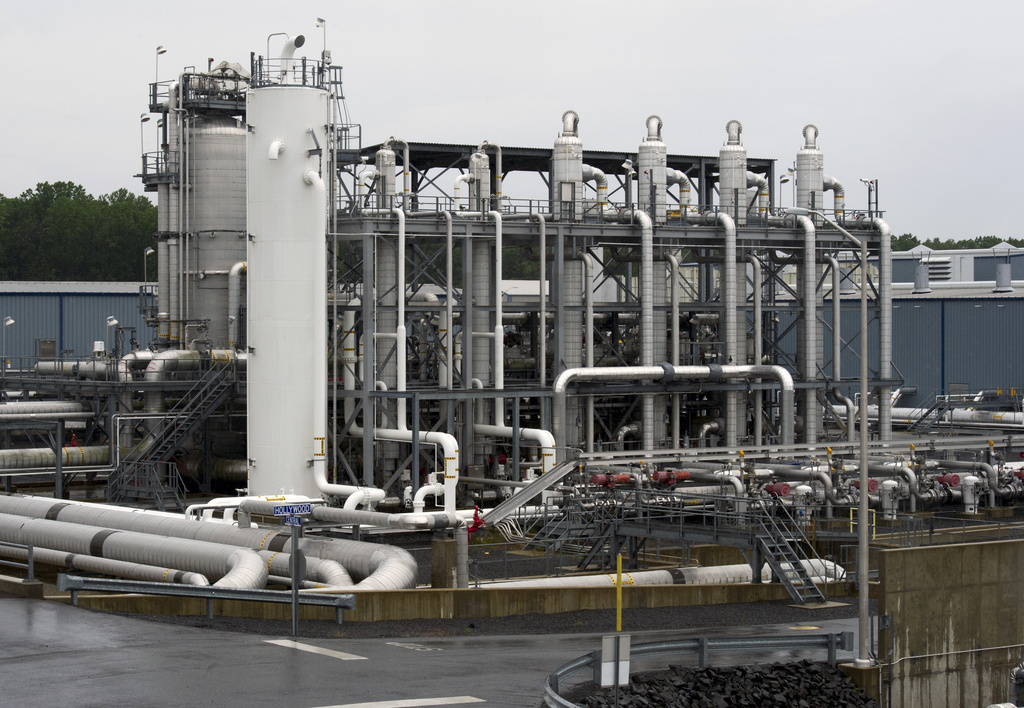 FILE - A heat exchanger and transfer pipes at Dominion Energy's Cove Point LNG Terminal in Lusby, Md., June 12, 2014. The Biden administration is delaying consideration of new natural gas export terminals in the United States, even as gas shipments to Europe and Asia have soared since Russia’s invasion of Ukraine.