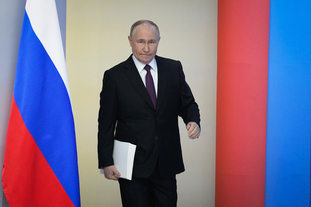 Russian President Vladimir Putin enters a hall to deliver his state-of-the-nation address in Moscow, Russia, Thursday, Feb. 29, 2024.