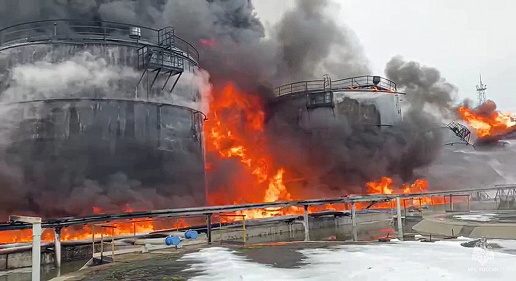 In this photo taken from video released by Governor of Bryansk Region Alexander Bogomaz telegram channel AV BogomaZ on Friday, Jan. 19, 2024, Oil reservoirs are seen in fire after the drone reached Klintsy, a city in Bryansk Region of Russia, about 60 kilometers (40 miles) from the Russia-Ukrainian border. A Russian official says a Ukrainian drone has struck an oil storage depot in western Russia, causing a massive blaze. (