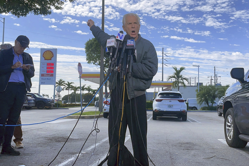 Former Trump White House official Peter Navarro speaks to reporters before he heads to prison, Tuesday, March 19, 2024 at Miami.
