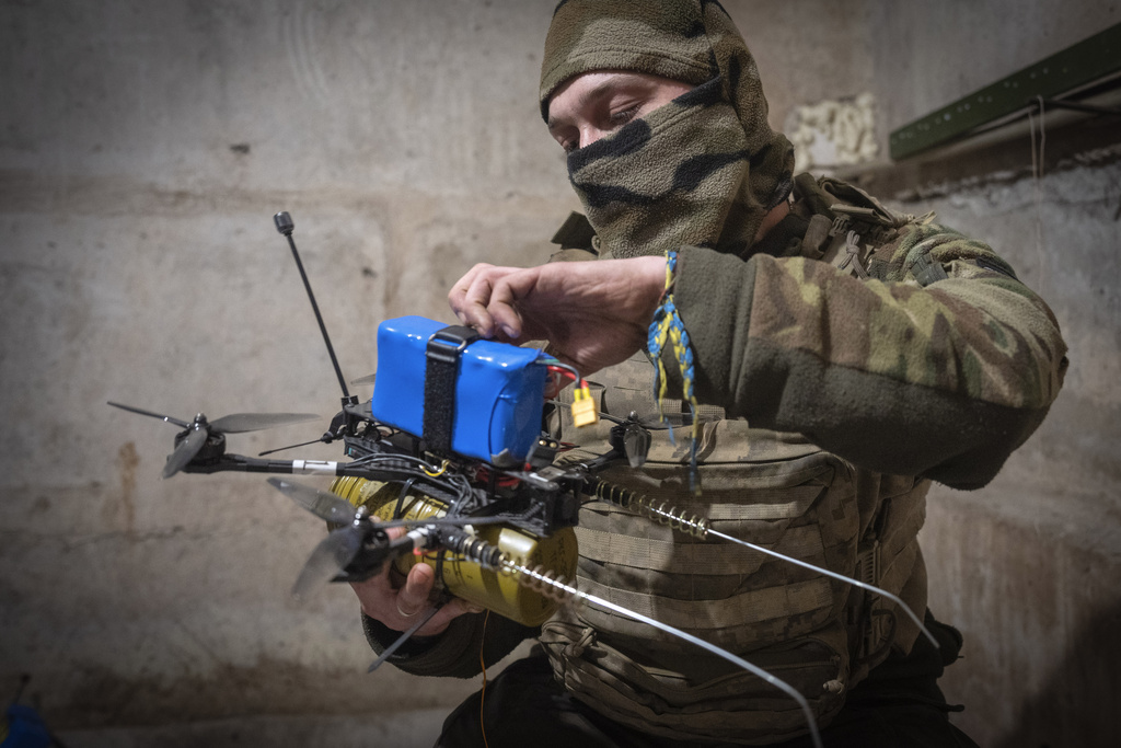 A Ukrainian soldier of the 71st Jaeger Brigade prepares a FPV drone at the frontline, near Avdiivka, Donetsk region, Ukraine, Friday, March 22, 2024.