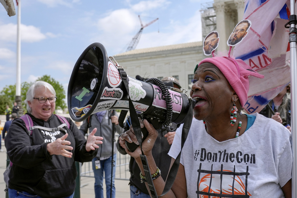 Demonstrators protest outside the Supreme Court as the justices prepare to hear arguments over whether President Trump is immune from prosecution. Capitol Hill Thursday, April 25, 2024, at Washington.