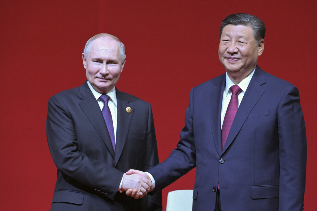 Russian President Vladimir Putin, left, and Chinese President Xi Jinping shake hands during a concert marking the 75th anniversary of the establishment of diplomatic relations between Russia and China and opening of China-Russia Years of Culture at the National Centre for the Performing Arts in Beijing, China, on Thursday, May 16, 2024.