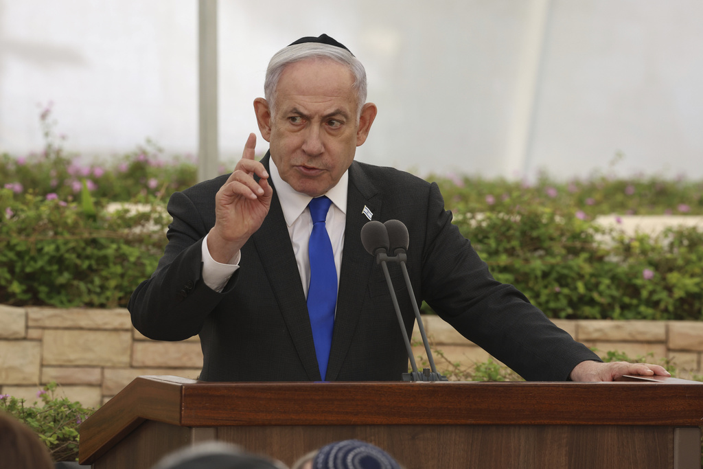 Israeli Prime Minister Benjamin Netanyahu speaks during a ceremony at the Nahalat Yitshak Cemetery in Tel Aviv, Israel, Tuesday, June 18, 2024. The ceremony marked the annual memorial for people killed in Israel’s Altalena affair -- a violent clash between rival Jewish forces that nearly pushed the newly independent Israel into civil war in 1948.