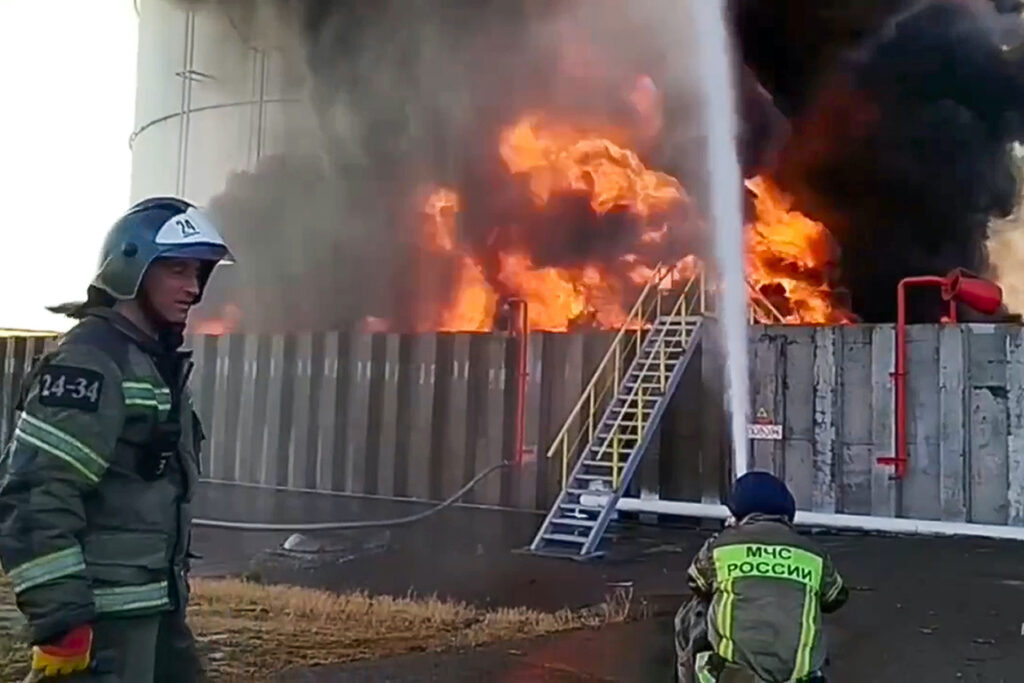 In this photo taken from video released by Russian Emergency Ministry Press Service on Tuesday, June 18, 2024, firefighters work at the site of an oil reservoir in Azov district of Rostov-on-Don region of Russia. Vasily Golubev, the governor of the Rostov region, said that a Ukrainian drone attack caused a fire at an oil reservoir. The Emergencies Ministry said over 70 firefighters are fighting the blaze that covers the area of 5,000 square meters.