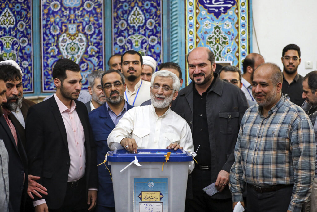 In this photo provided by Iranian Students' News Agency, ISNA, hard-line former Iranian senior nuclear negotiator and candidate for the presidential election Saeed Jalili casts his ballot in a polling station, in Tehran, Iran, Friday, June 28, 2024. Iranians are voting in a snap election to replace the late hard-line President Ebrahim Raisi.
