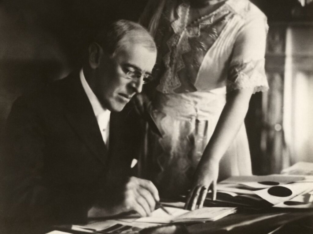 President Wilson in June 1920 at the White House after his stroke, with his wife at his side.