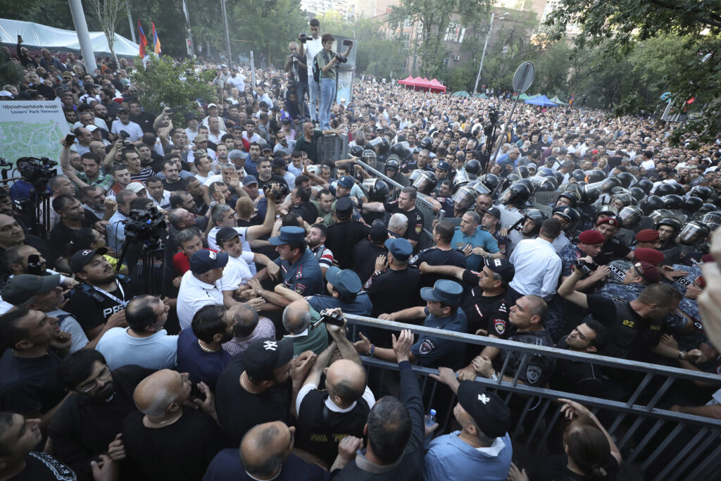 CORRECTS BYLINE - Police blocked the way to protesters during a rally against Prime Minister Nikol Pashinyan in Yerevan, Armenia, Wednesday, June 12, 2024