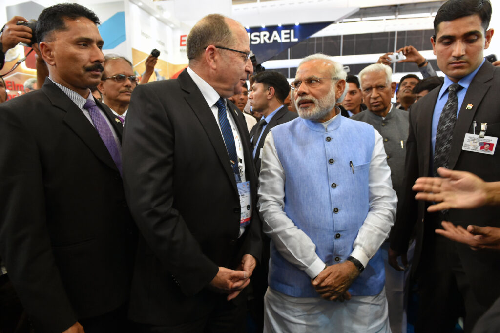 BANGALORE, INDIA - FEBRUARY 18:   (ISRAEL OUT) In this handout provided by the Israeli Ministry of Defence,  Israeli Defense Minister Moshe Ya'alon visits the arms exhibition in India with Indian Prime Minister Narendra Modi at Aero India 2015 on February 18, 2015 in Bangalore, India.  Defense Minister Moshe Ya'alon is in India, marking the first state visit by an Israeli defense minister to that nation.  (Photo by Ariel Hermoni-Levine /Israeli Ministry of Defense via Getty Images)