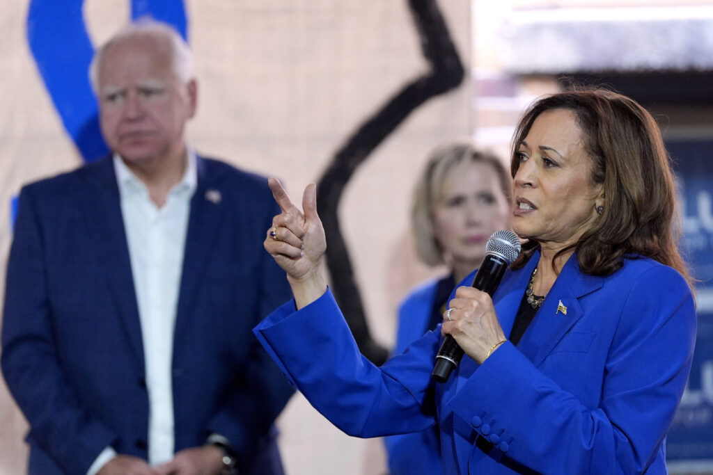 Democratic presidential nominee Vice President Kamala Harris, right, speaks as Democratic vice presidential nominee Minnesota Gov. Tim Walz, left, and his wife Gwen Walz listen at a campaign event, Sunday, Aug. 18, 2024, in Rochester, Pa.