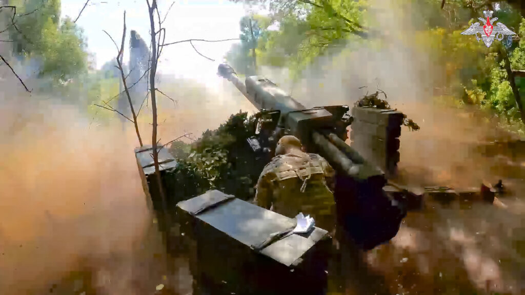 In this photo taken from video released by the Russian Defense Ministry on Wednesday, Aug. 7, 2024, a Russian soldier fires from D-30 howitzer towards Ukrainian positions in an undisclosed location in Ukraine.