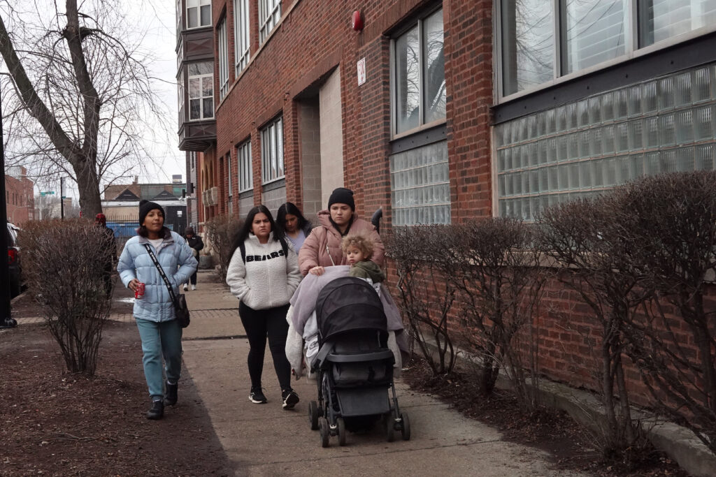 Family members, recent migrants from Venezuela, leave a shelter at the West Loop neighborhood on January 30, 2024 at Chicago, Illinois.