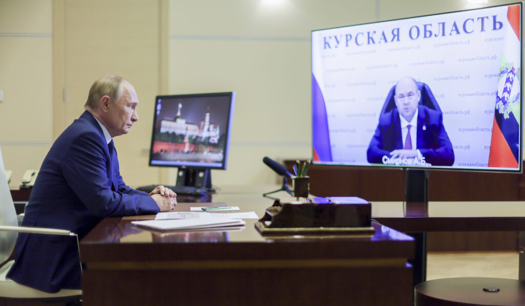 FILE - Russian President Vladimir Putin, left, listens to acting Gov. Alexei Smirnov of the Kursk region during a videoconference at Putin’s Novo-Ogaryovo state residence outside Moscow, Russia, on Aug. 8, 2024.