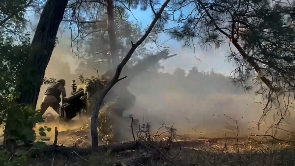 In this photo taken from video released by the Russian Defense Ministry on Friday, July 12, 2024, Russian soldiers fire from their howitzer from their position at Ukrainian troops at an undisclosed location in Ukraine.