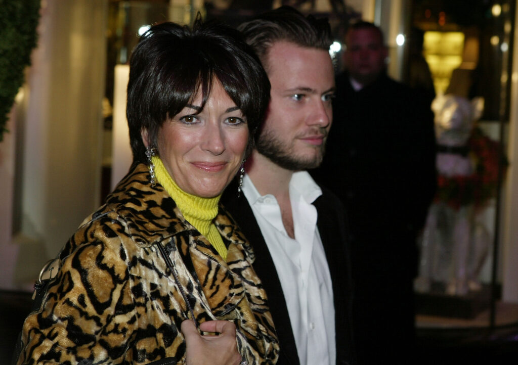 NEW YORK - DECEMBER 8: Socialite Ghislaine Maxwell with an unidentified male companion attends the Opening of the Asprey Flagship Store on 5th Avenue December 8, 2003 in New York City. (Photo by
