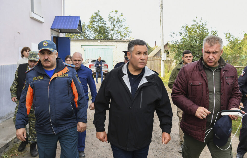 In this photo released by Press Service of the Government of the Tver Region of Russia on Wednesday, Sept. 18, 2024, Tver region governor Igor Rudenya, center, arrives to attend a meeting of the operational headquarters in Toropets, following the strike by Unmanned Aerial Vehicles in Toropets, Russia.