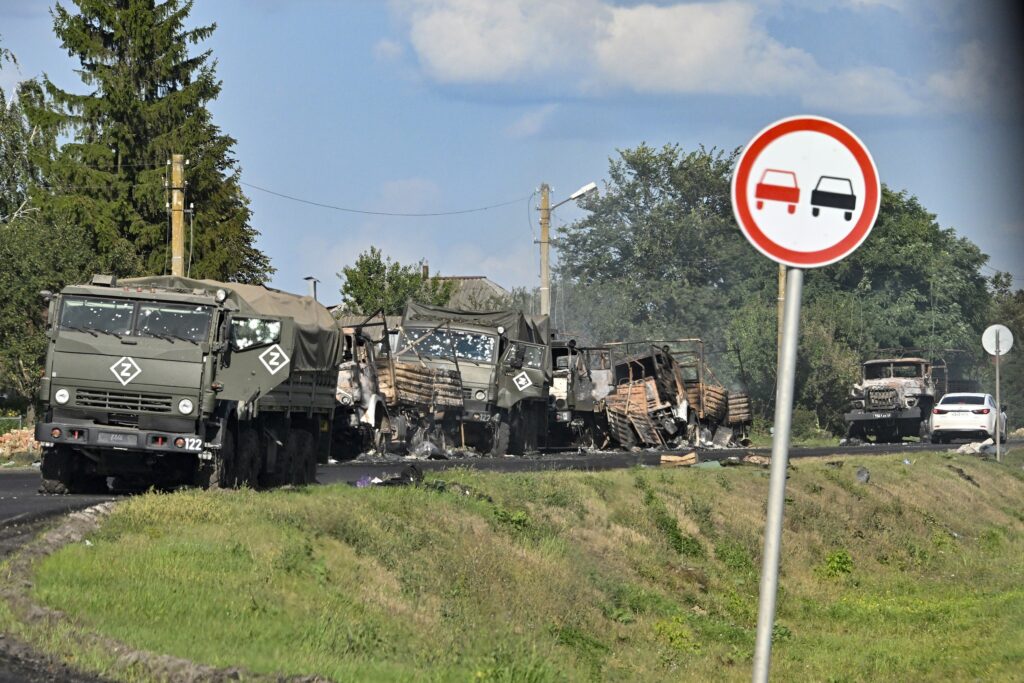 FILE - A column of Russian army trucks damaged by shelling by Ukrainian forces is seen on the highway in the Sudzhansky district in the Kursk region of Russia, on Aug. 9, 2024.