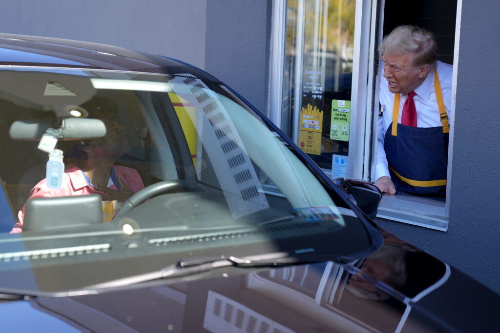 President Trump speaks to a customer at a drive-thru window during a campaign stop at a McDonald's at Feasterville-Trevose, Pennsylvania.