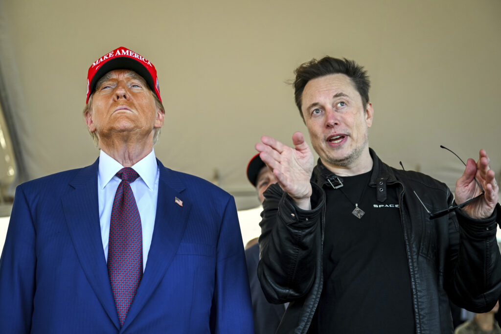 President-elect Donald Trump listens to Elon Musk as he arrives to watch SpaceX's mega rocket Starship lift off for a test flight from Starbase in Boca Chica, Texas, November 19, 2024. (Brandon Bell/Pool via AP)