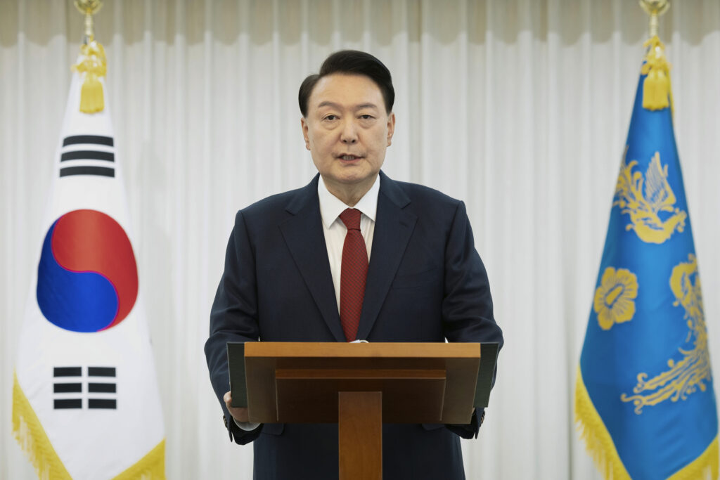 In this photo released by South Korean President Office via Yonhap, South Korean President Yoon Suk Yeol speaks at the presidential residence in Seoul, South Korea, Saturday, Dec. 14, 2024.