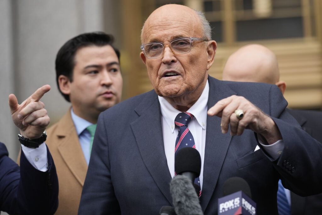 Rudy Giuliani speaks to reporters as he leaves the federal courthouse in New York, Nov. 26, 2024. (AP Photo/Seth Wenig, File)