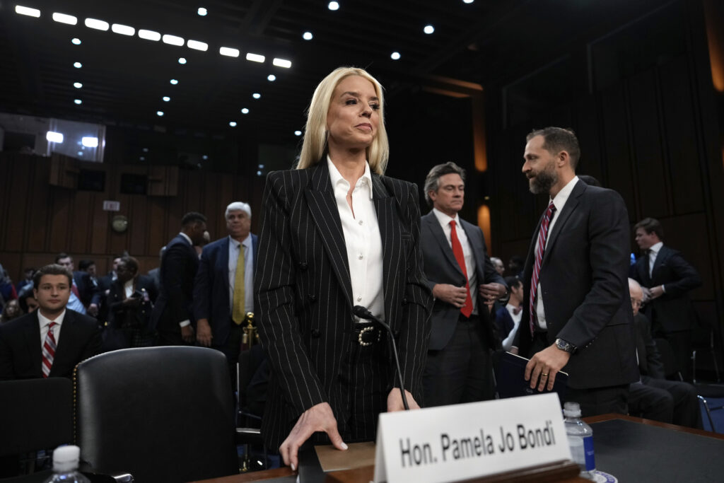 President Trump's choice to lead the Justice Department as attorney general, Pam Bondi, stands for a break during the Senate Judiciary Committee for her confirmation hearing, at the Capitol at Washington January 15, 2025.