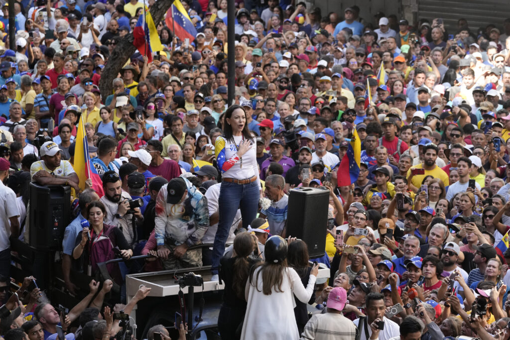 Opposition leader Maria Corina Machado stands before supporters during a protest against President Nicolas Maduro the day before his inauguration for a third term, in Caracas, Venezuela, Thursday, Jan. 9, 2025.