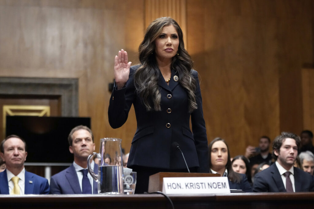 Kristi Noem, President Trump's pick to be Secretary of Homeland Security, is sworn in before the Senate Homeland Security and Governmental Affairs Committee for her confirmation hearing.