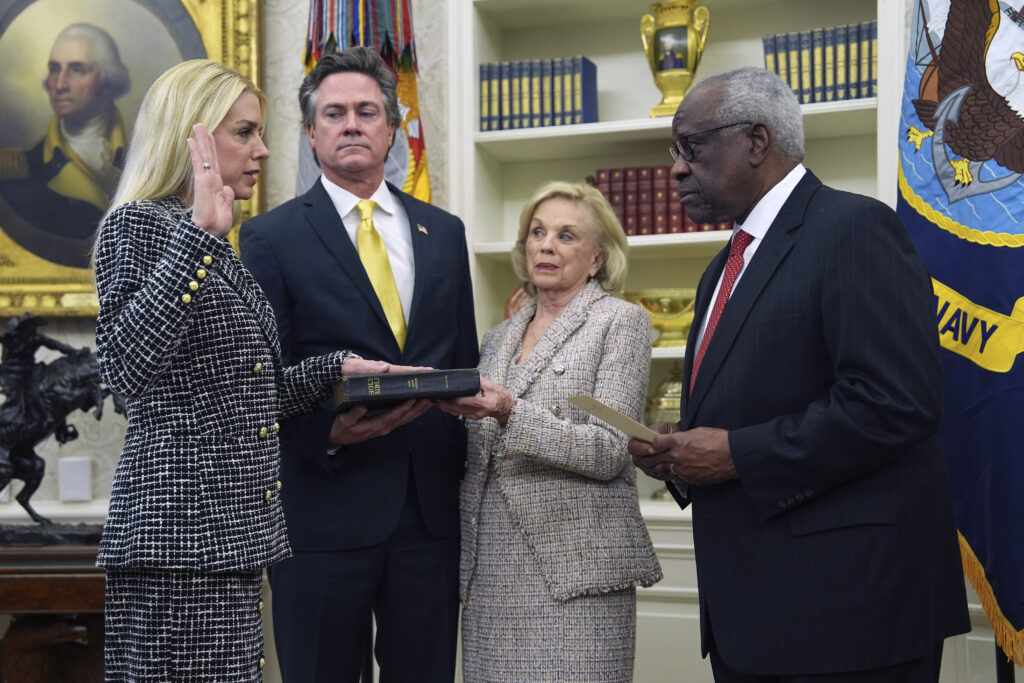 Pam Bondi is sworn in as Attorney General by Supreme Court Associate Justice Clarence Thomas.